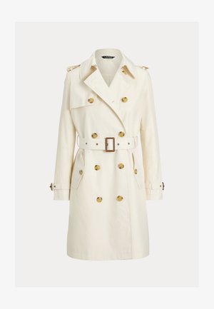 Gabardina cruzada de tela color crema, con botones dorados, cinturón a juego y hombreras. Mangas largas y bolsillos laterales.