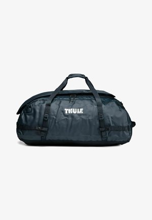 Black Thule duffel bag with dual carrying handles, zipper closure, and brand logo centered on front panel.