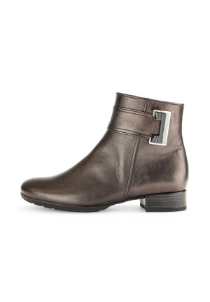 Brown leather ankle boot with a straight silhouette, rounded toe, and a silver rectangular buckle accent on the side. Low block heel.