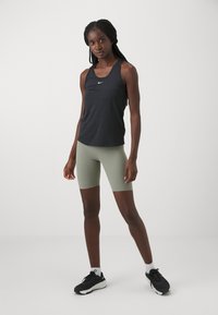 Nike Performance ZENVY - Leggings - light army/black