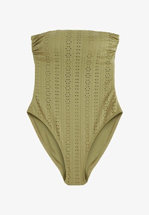 Olíva zöld, pánt nélküli egyrészes fürdőruha perforált dizájnnal és magas kivágással. Simaságot kölcsönöz a bordázott részletek.