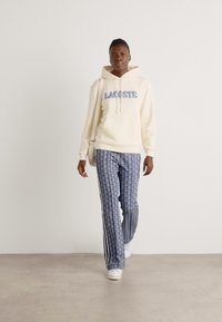 Lacoste Kapuutsiga pusa - lapland
