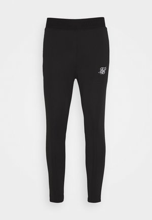 Schwarze enganliegende Leggings mit elastischem Bund und kleinem weißen besticktem Logo am oberen linken Oberschenkel.