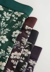 Quatre sweat-shirts pliés à motif floral en vert, marron, gris foncé et violet avec des poignets côtelés sur fond blanc.