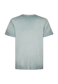 T-shirt en coton bleu clair à manches courtes, col rond, avec une surface lisse et légèrement texturée. Aucune motif ni graphique visible.