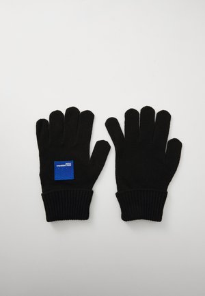 Black knit gloves with ribbed cuffs and a small blue label on one glove. Features five finger openings. Material is soft and flexible.