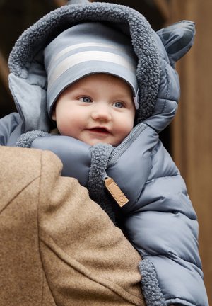 Light blue puffer jacket with fuzzy gray lining, featuring a hood and a tag. The child inside wears a matching striped hat.