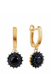 Złote kolczyki w kształcie obręczy z okrągłym zwisem, akcentowane czarnymi kryształami, o teksturze koralikowej i fasetowanej centralnej części.