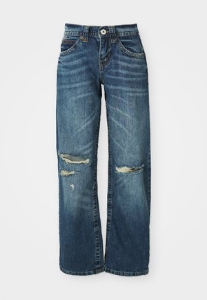 Blue denim jeans with a wide-leg cut, featuring distressed areas, frayed rips above the knees, and standard button-and-zip closure.