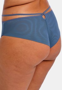 Blue mesh high-waisted brief with a smooth texture, featuring dual straps and a keyhole detail at the back.