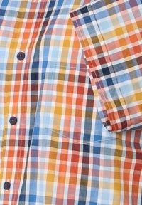 Skjorte med plaid i blå, orange og gule nuancer. Letvægtsstof med et tekstureret ternet mønster og kontrastknapper. Korte ærmer.