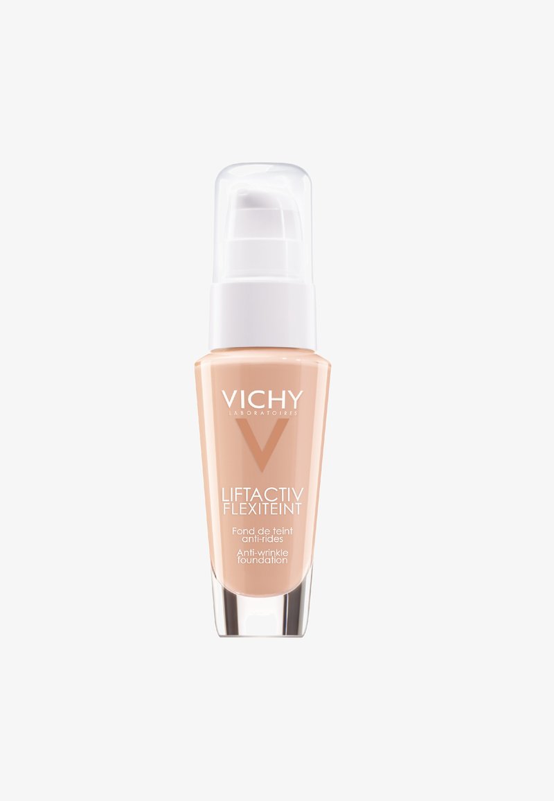 Vichy Liftactiv Flexiteint foundation in a clear glass bottle with a white pump. Light beige liquid with smooth texture. Sleek, modern design.
