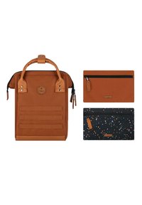 Brown canvas backpack with top handles, featuring three horizontal straps; includes two pouches, one solid brown and one black with colorful specks.