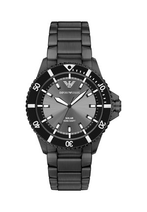 Black metal wristwatch with a rotating bezel, gray dial, bold hour markers, and three hands showing 10:09:36, labeled solar and water resistant.