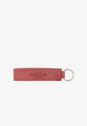 Rectangular dusty pink suede leather keychain with "Gusti Leder studio" stamped and a silver metal keyring attached.
