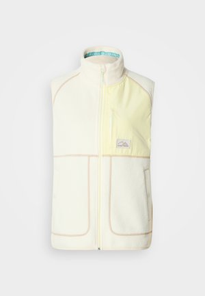 Fleece γιλέκο σε εκρού με ανοιχτό κίτρινα διακοσμητικά, πλήρης φερμουάρ, ψηλός γιακάς, δύο μπροστινές τσέπες και μπλε φόδρα με σχέδιο στο εσωτερικό.