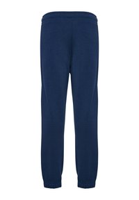 Pantalons de survêtement bleu marine en tissu doux, dotés d'une taille élastique et de poignets resserrés aux chevilles. Design simple et uni sans motifs.