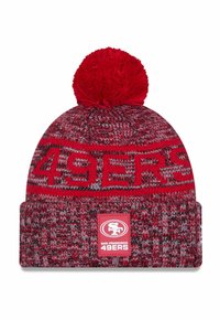 Red knit beanie with a pom-pom, featuring a striped design and "49ERS" text. Includes a logo patch on the cuff in contrasting colors.