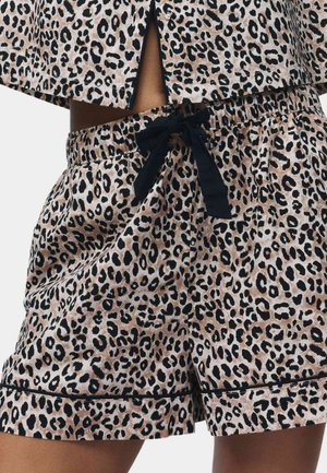 Shorts met luipaardprint, gemaakt van zachte stof. Beschikt over een elastische taille met een zwarte trekkoord en zwarte rand langs de zoom.