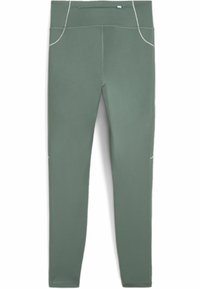 Vihreät urheiluleggingsit, jotka on valmistettu joustavasta kankaasta. Niissä on korkea vyötärö, litteät saumat ja heijastavat yksityiskohdat taskuissa.