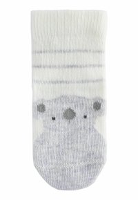 Hellgraue und weiße gestreifte Socke mit einem Bärenkopfdesign. Aus weichem Baumwollmaterial, mit zwei dunkelgrauen Punkten für Augen und einer Nase.