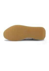 Semelle de chaussure avec grip en caoutchouc brun clair présentant un motif de bande de roulement circulaire, vue de dessous sur fond blanc.