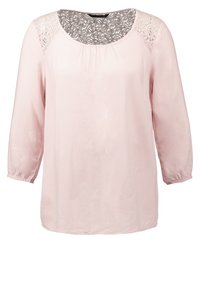 Blouse rose clair à manches longues avec poignets élastiques et détails en dentelle sur les épaules et le haut du dos, dotée d'un col rond.