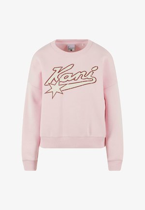 Ružový sveter s okrúhlym výstrihom. Obsahuje štruktúrované logo "Kani" a grafiku hviezdy v kontrastnej farbe. Rúbkové manžety a lem.