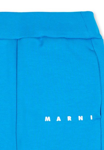 Pantalon de survêtement en coton bleu avec une ceinture côtelée et un logo imprimé blanc "MARNI" sur le côté inférieur. Texture douce avec une silhouette ajustée.