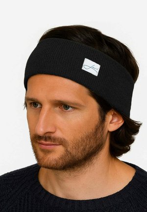 Schwarzes gestricktes Stirnband aus weichem Material, mit einem kleinen weißen Etikett mit blauem Logo. Entwickelt, um eng am Kopf zu sitzen.