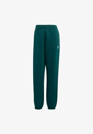 Grüne Sweatpants aus weichem Stoff, mit elastischem Bund, schmal zulaufenden Beinen und kleinem weißen Logo am unteren linken Bein.