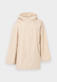 Veste de pluie beige à capuche avec une fermeture éclair intégrale à l'avant, coupe ample, deux poches latérales et matériau lisse et résistant à l'eau.