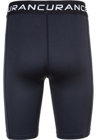 Svarta kompressionsshorts med en figurnära design, som har en bred elastisk midjeband med vit text och ett mjukt, stretchigt tyg.