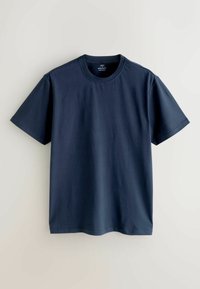 T-shirt en coton bleu marine avec un col rond, des manches courtes et une coupe régulière. Texture lisse et sans motifs ni accents remarquables.