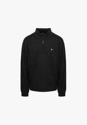 Sort langærmet pullover med kvart lynlås i kraven og lille gul fuglelogo på venstre bryst.