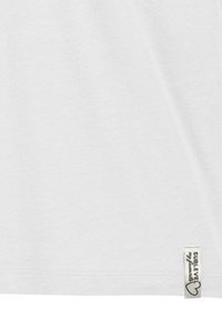 White cotton t-shirt featuring a smooth texture, rounded neckline, and a side label with black text and a heart icon.