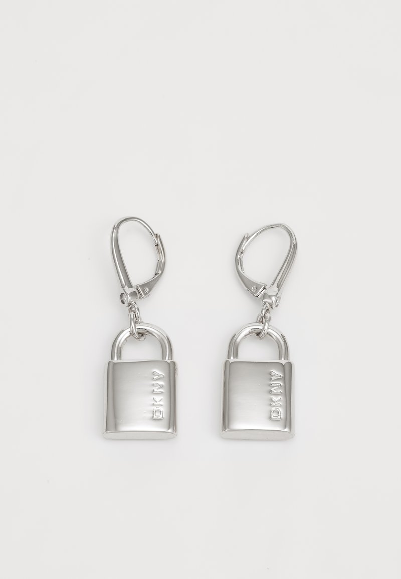 Silver metal earrings shaped like padlocks with a polished finish, featuring a lever-back closure and engraved branding on the front.
