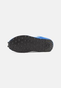 Blue athletic shoe featuring a textured upper with a suede finish and a black rubber outsole with round traction knobs.