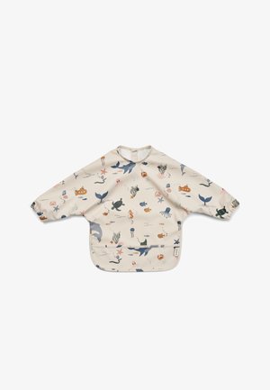 Blouse beige à manches longues pour tout-petit avec poignets élastiques et imprimés sur le thème de l'océan, comprenant des baleines, des tortues, des poissons, des dauphins et des algues.