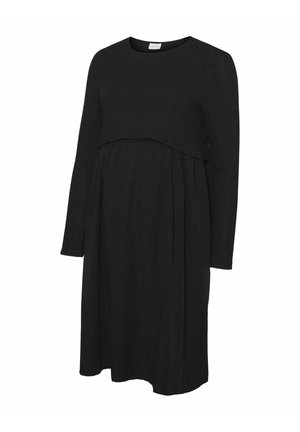 Zwarte zwangerschapsjurk met een top met lange mouwen en een ronde onderkant, boven een vloeiende, geraffineerde rok voor comfort en veelzijdigheid.