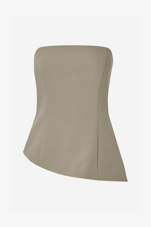 Beige stroppeløs topp med en strukturert design, som har en tettsittende bodice og en asymmetrisk kant som flommer ut forsiktig. Glatt stofftekstur.