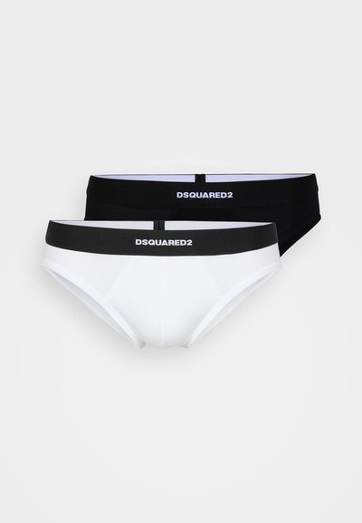 Caleçons en coton noir et blanc avec ceintures élastiques, arborant le logo "DSQUARED2". Le design comprend une coupe classique sans motifs.