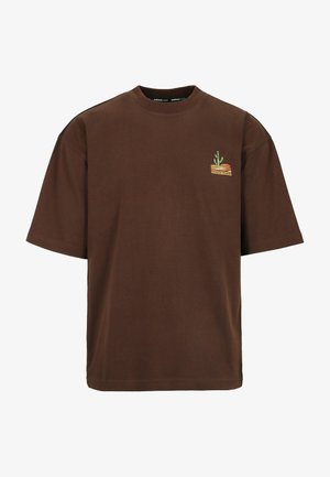 Brown short-sleeve T-shirt with small cactus and sunset graphic on left chest and round neckline.