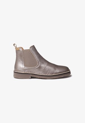 Metallic silver Chelsea boot with elastic side panels, textured leather upper, and a flat rubber sole, featuring a pull tab for easy wear.