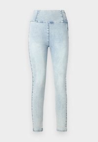 Svetlo modré denim legíny s vysokým pásom a úzkym strihom. Obsahujú jemné vyblednutie a prešité detaily pozdĺž švov.