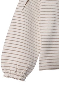 Tissu crème avec des rayures dorées métalliques. Manches longues avec des poignets froncés. Texture douce, design décontracté et motif discret.