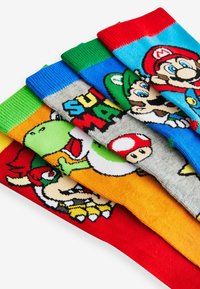 Fünf Paare farbenfroher Baumwollsocken mit Cartoon-Charakteren aus Super Mario. Jede Socke hat einzigartige Designs und lebendige Streifen.