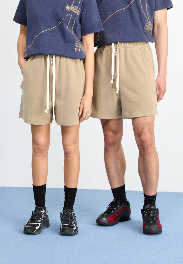 LANIK UNISEX - Tracksuit bottoms - beige