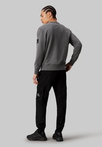 Calvin Klein Jeans WASHED - Kapsáče - ck black