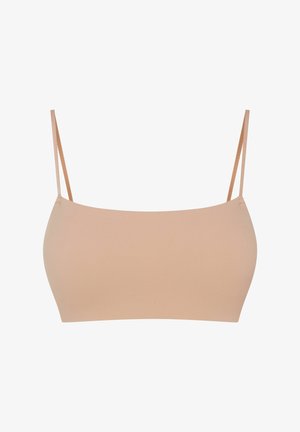 Beżowy bezszwowy biustonosz braletka z regulowanymi cienkimi ramiączkami, oferujący gładką, elastyczną fakturę i minimalistyczny design. Bez wyściółki i fiszbin.